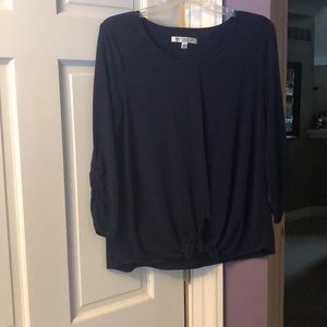 Long sleeve navy blue top. Tie bottom.